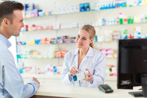 Pharmacist and client at pharmacy 