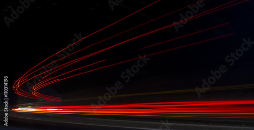 Truck light trails in tunnel. Art image . Long exposure photo taken in a tunnel