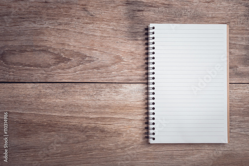 Notepad / lined paper on wooden table top view