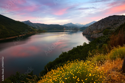 Summer mountains landscape with lake in sunset photo