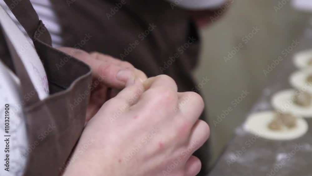 Womens cooking dumplings with meat. Womens cooking dumplings with meat.