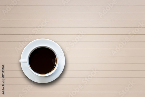 White coffee cup on wooden table top view