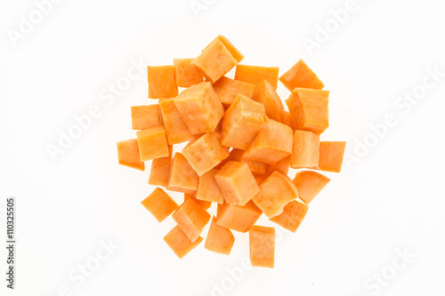 Fresh sweet potato cut into cubes , isolated on white background