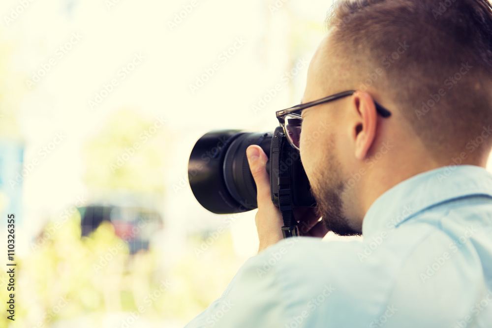 close up of male photographer with digital camera close up of male photographer with digital camera
