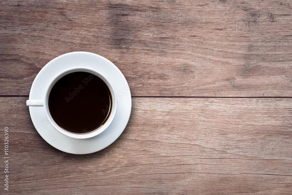 White coffee cup on wooden table top view White coffee cup on wooden table top view
