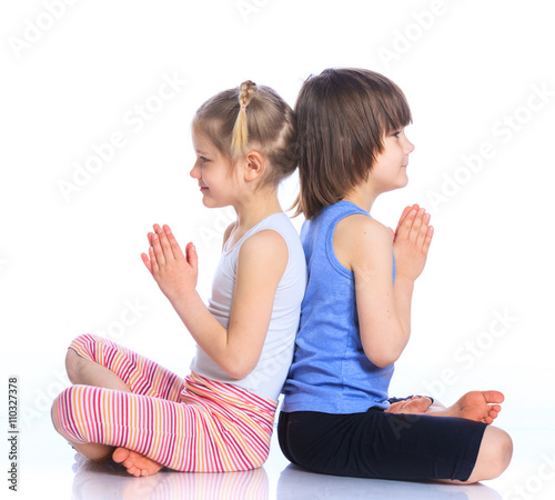 Kids practice yoga