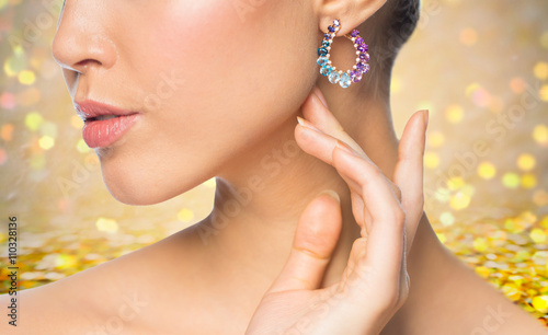 close up of beautiful woman face with earring