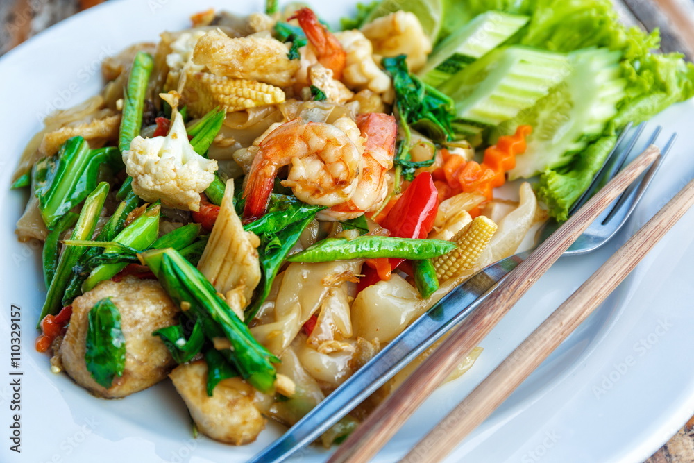 Fried vegetables and seafood in sauce Fried vegetables and seafood in sauce