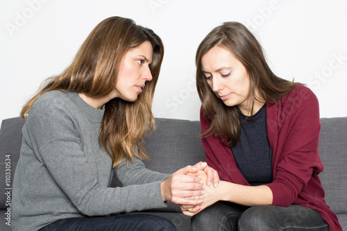 woman comforting a female friend photo