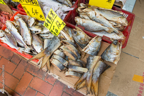 A selection of dry and cut fish outside at market