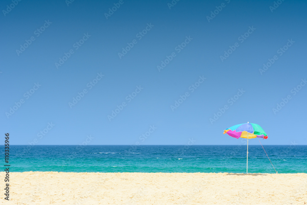 Colorful umbrella on a beautiful tropical beach