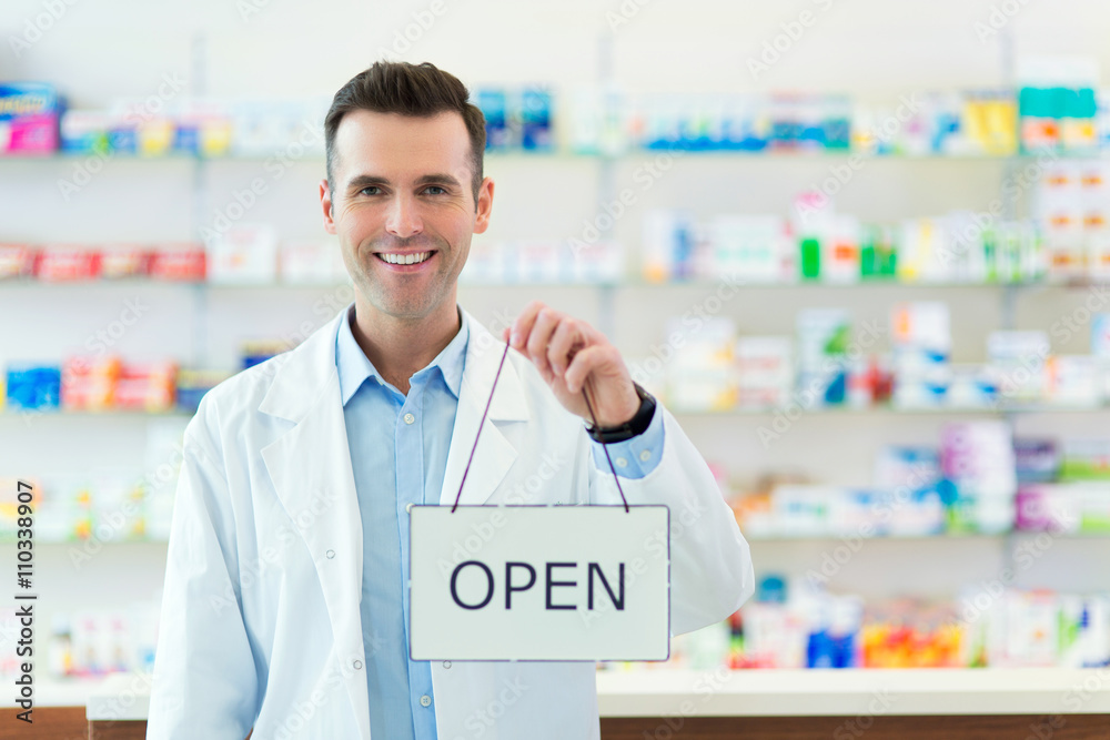 Pharmacist Holding An Open Sign
Pharmacist Holding An Open Sign