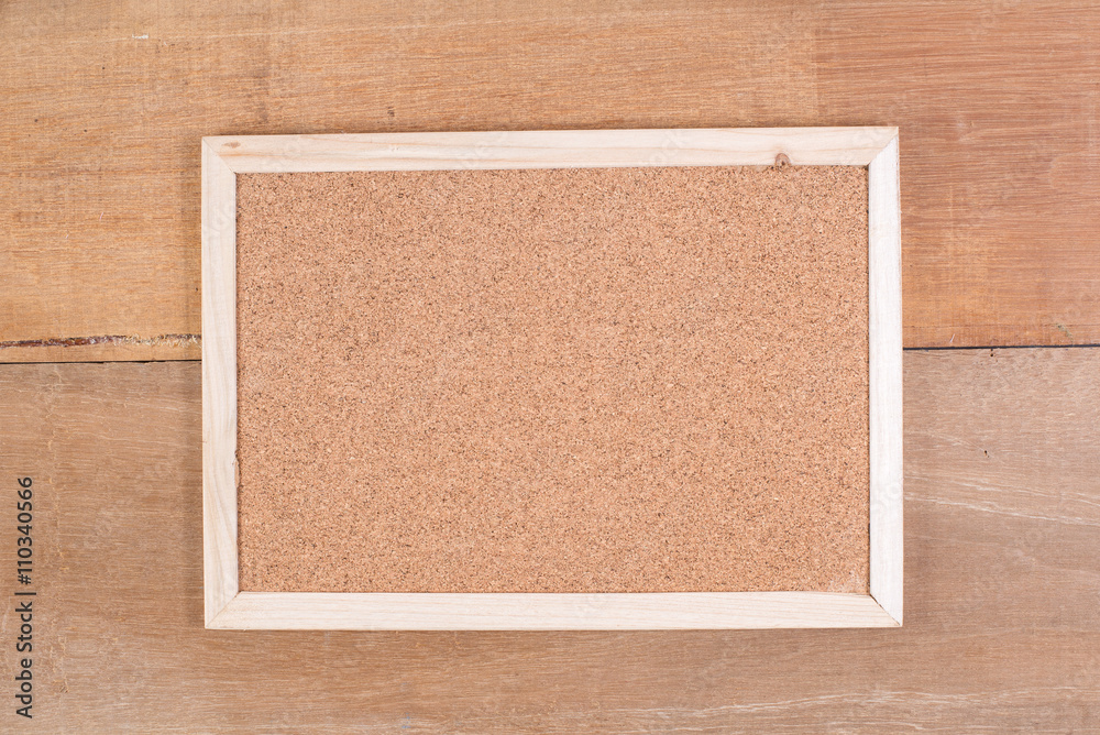Fototapeta premium The cork board on the plank wood