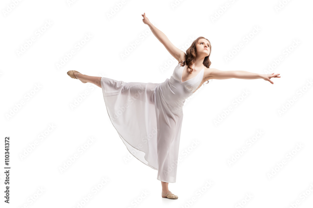 Young woman dancing in dress over white