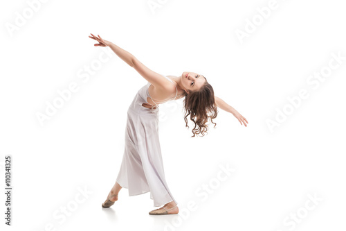 Fototapeta Naklejka Na Ścianę i Meble -  Young woman dancing in dress over white