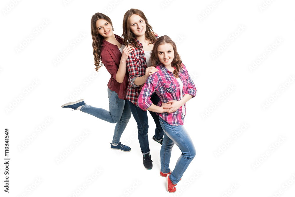 three young women posing over white background three young women posing over white background