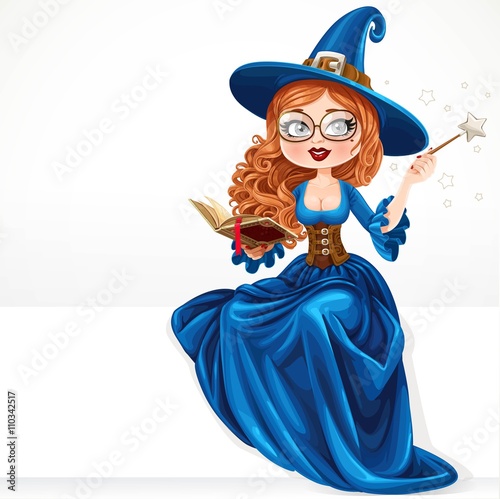 Beautiful witch wearing in blue dress holding a magic wand and b