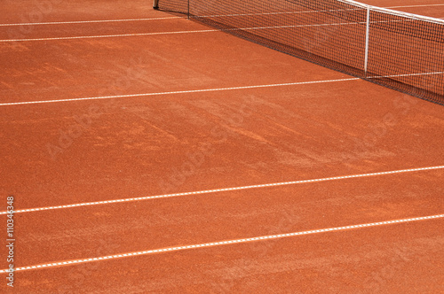 Detail of clay tennis court with net and lines closeup  © varbenov