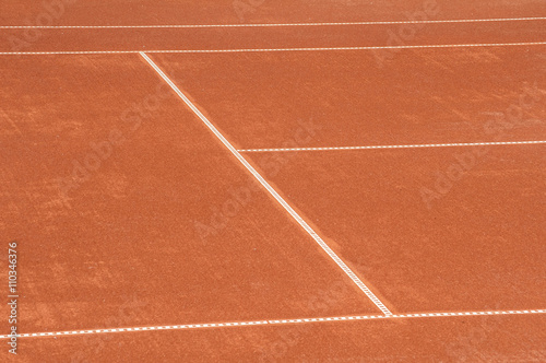 Detail of clay tennis court with lines closeup 