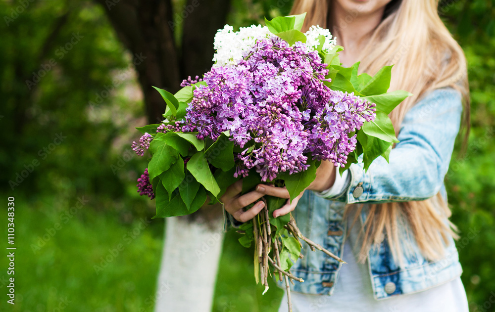 blooming lilac flowers in hand blooming lilac flowers in hand