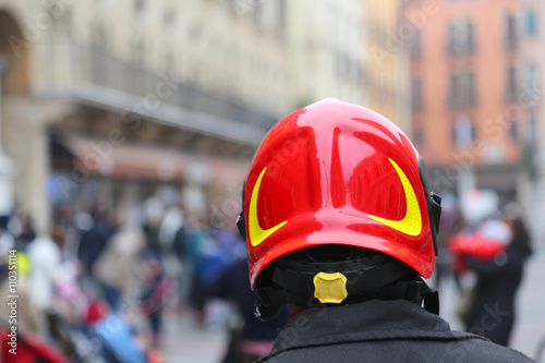 fireman with red Hardhat controls the people of the city © ChiccoDodiFC