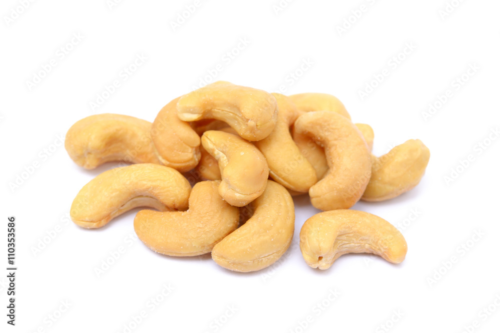 Roasted salted cashews isolated on a white background Roasted salted cashews isolated on a white background
