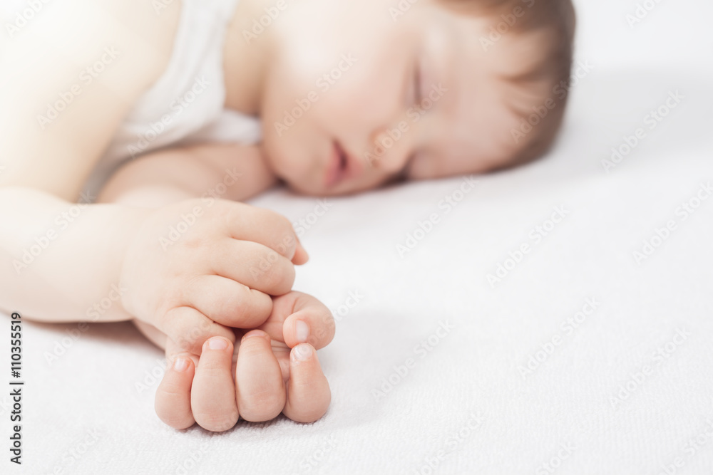 Newborn baby sweet sleeping on a white bed Newborn baby sweet sleeping on a white bed