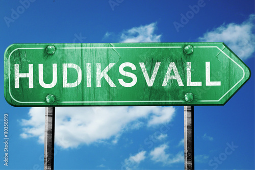 Hudiksvall, 3D rendering, a vintage green direction sign photo