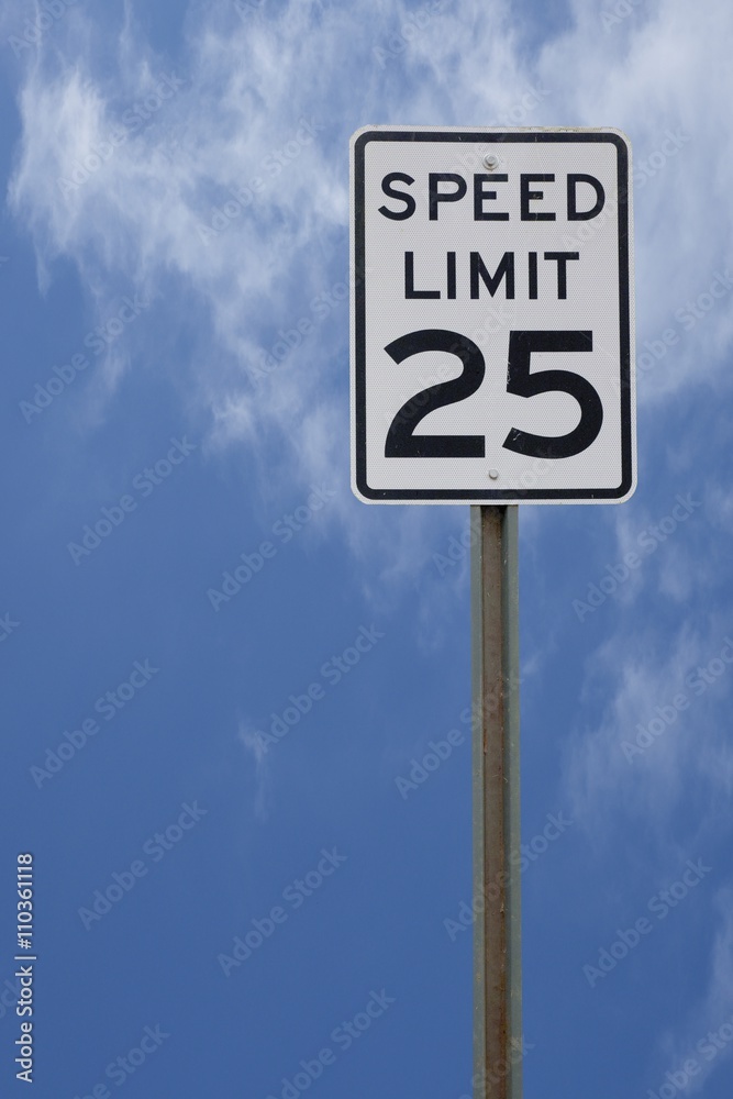 25 MPH SPEED LIMIT SIGH WITH BRIGHT BLUE SKY BACKGROUND
25 MPH SPEED LIMIT SIGH WITH BRIGHT BLUE SKY BACKGROUND