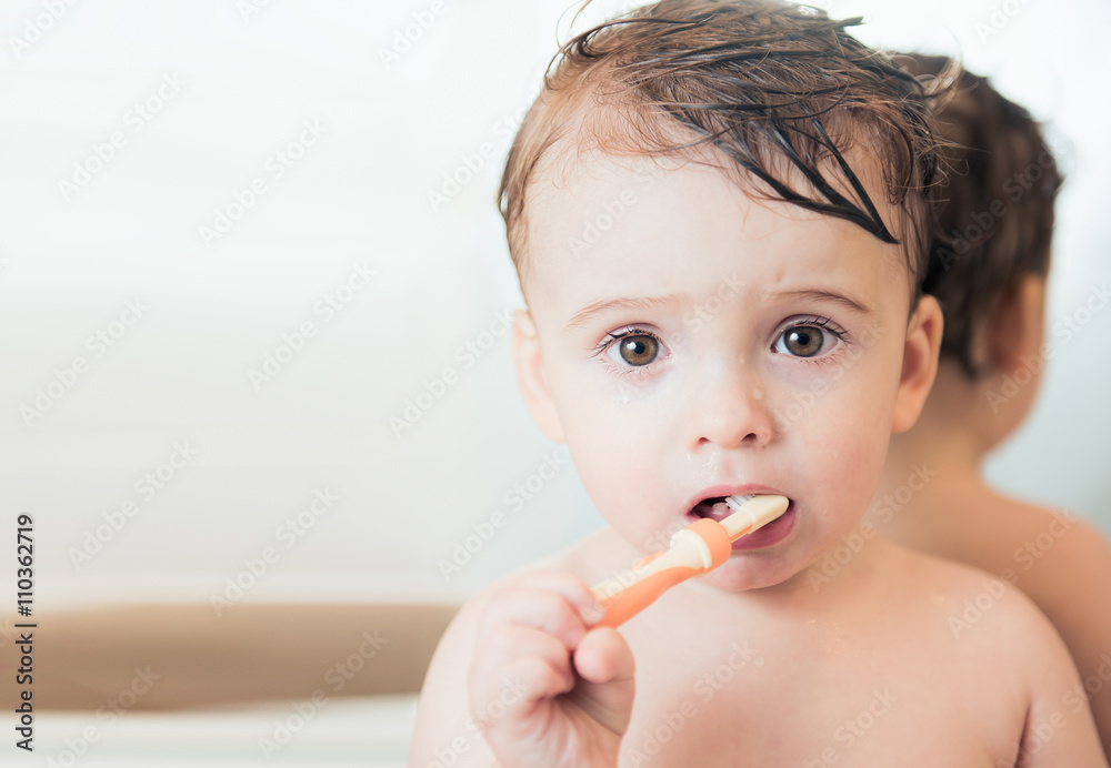 Cute beautiful boy at the bathroom washing his teeth Cute beautiful boy at the bathroom washing his teeth