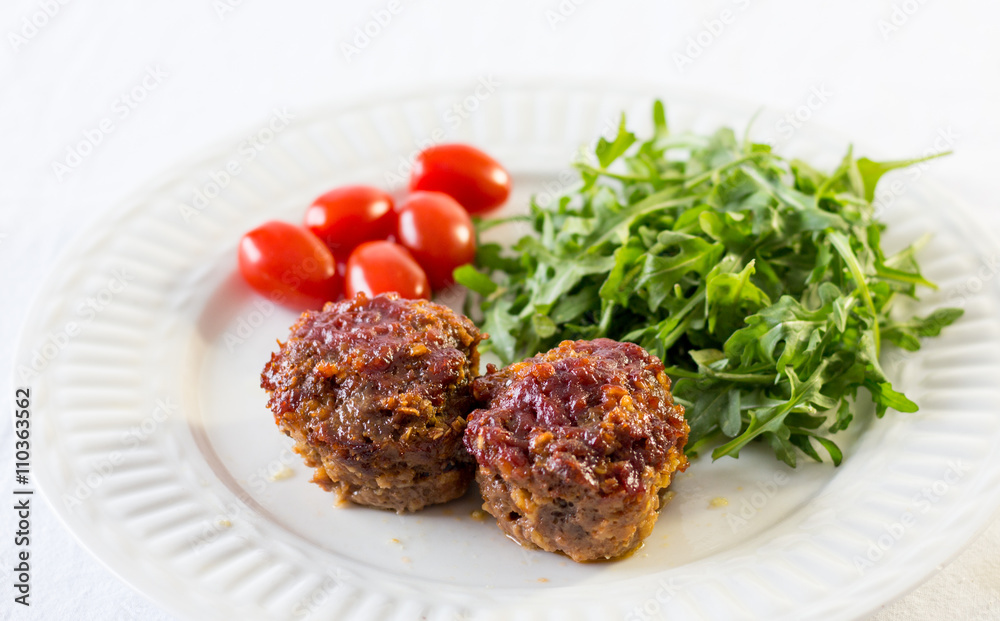 meatloaf and veggies close up on a white background meatloaf and veggies close up on a white background