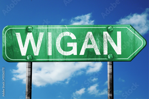 Wigan, 3D rendering, a vintage green direction sign photo