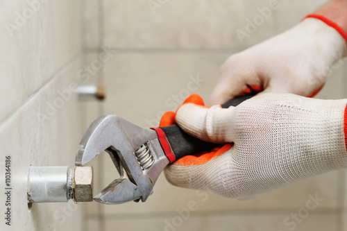 Worker unscrew the nut.