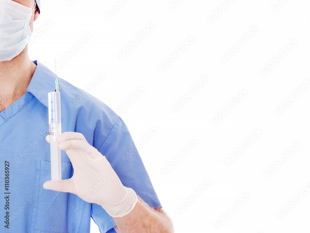 Male doctor holding a syringe in his hand. Male doctor holding a syringe in his hand.