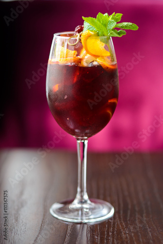 wine cocktail with mint garnish.