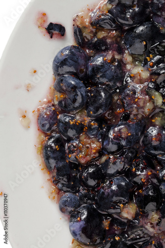 smash blueberries on white plate photo