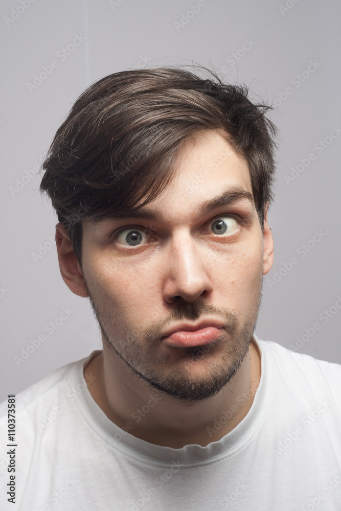 Man portrait, cross eyed, squint eyed, skew eye portrait. Man portrait, cross eyed, squint eyed, skew eye portrait.
