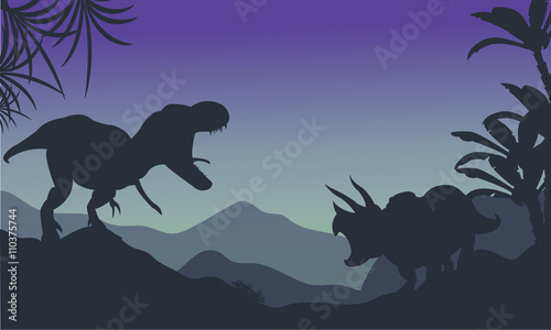 Silhouette of ankylosaurus and tyrannosaurus