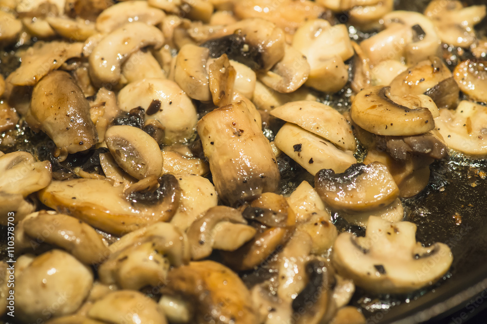 fried mushroom in frying pan fried mushroom in frying pan