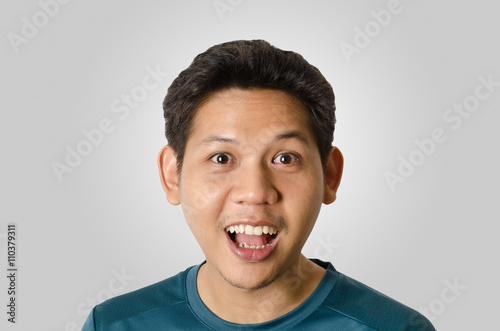 Portrait of asia man feeling wow, isolated on gray background