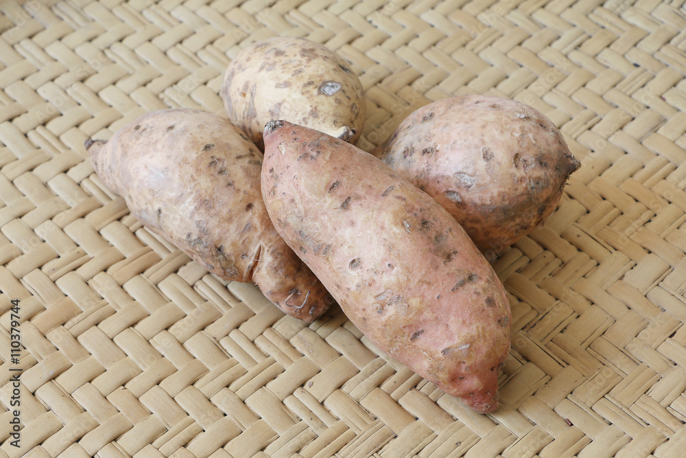 Sweet potato (Ubi manis) on bamboo mat Sweet potato (Ubi manis) on bamboo mat