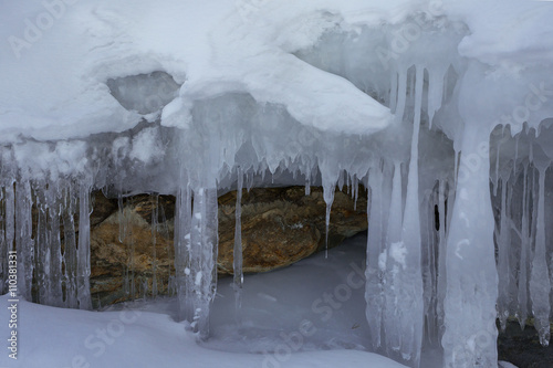 Huge icicles on a cliff.