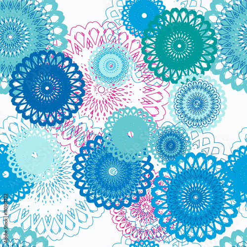Seamless pattern with stylized blue flowers, pink accents.
