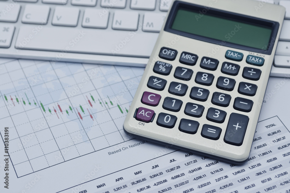 Calculator button plus on keyboard and graph paper, accounting b Calculator button plus on keyboard and graph paper, accounting b