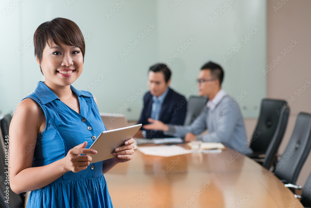 Portrait of cheerful young business lady holding digital tablet Portrait of cheerful young business lady holding digital tablet