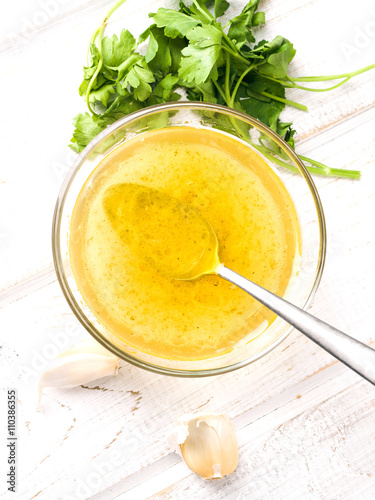 vinaigrette sauce in glass bowl photo