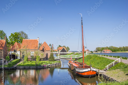 Old sailing ship in a canal in Enkhuizen photo