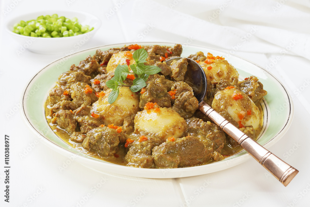 Beef Rendang. This is a Westernised version of Rendang, made with stewing steak and with extra liquid. Beef Rendang. This is a Westernised version of Rendang, made with stewing steak and with extra liquid.