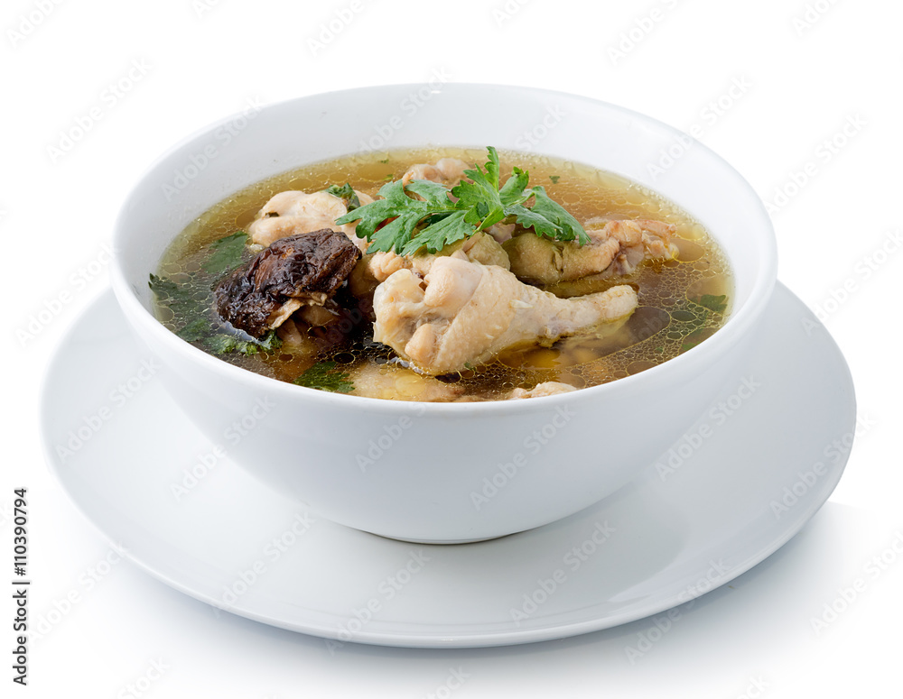 Traditional chicken broth on white background Traditional chicken broth on white background