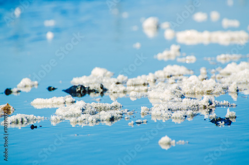 Deposits of mineral healing salt in the water, spa relaxing bodycare background